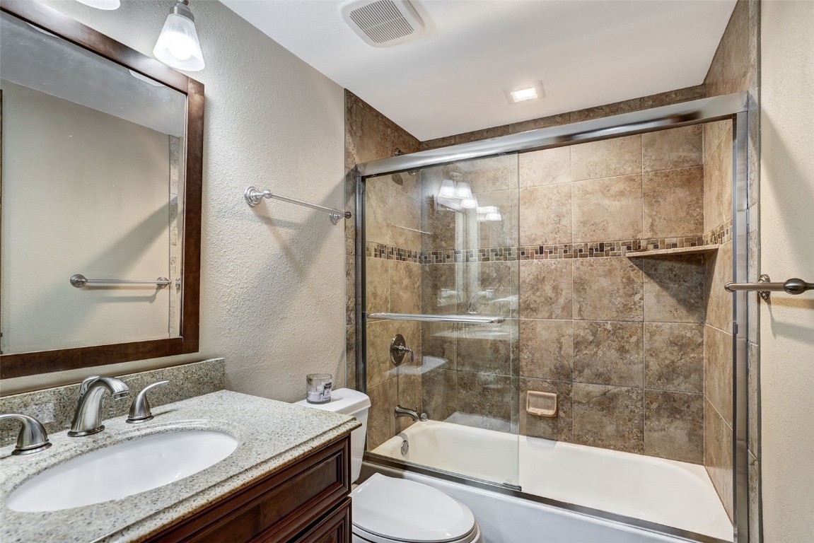 840 4 O Clock Road, Unit A1D Breckenridge, CO 80424 - Photo 18 of 38 a bathroom with a granite countertop sink toilet and shower