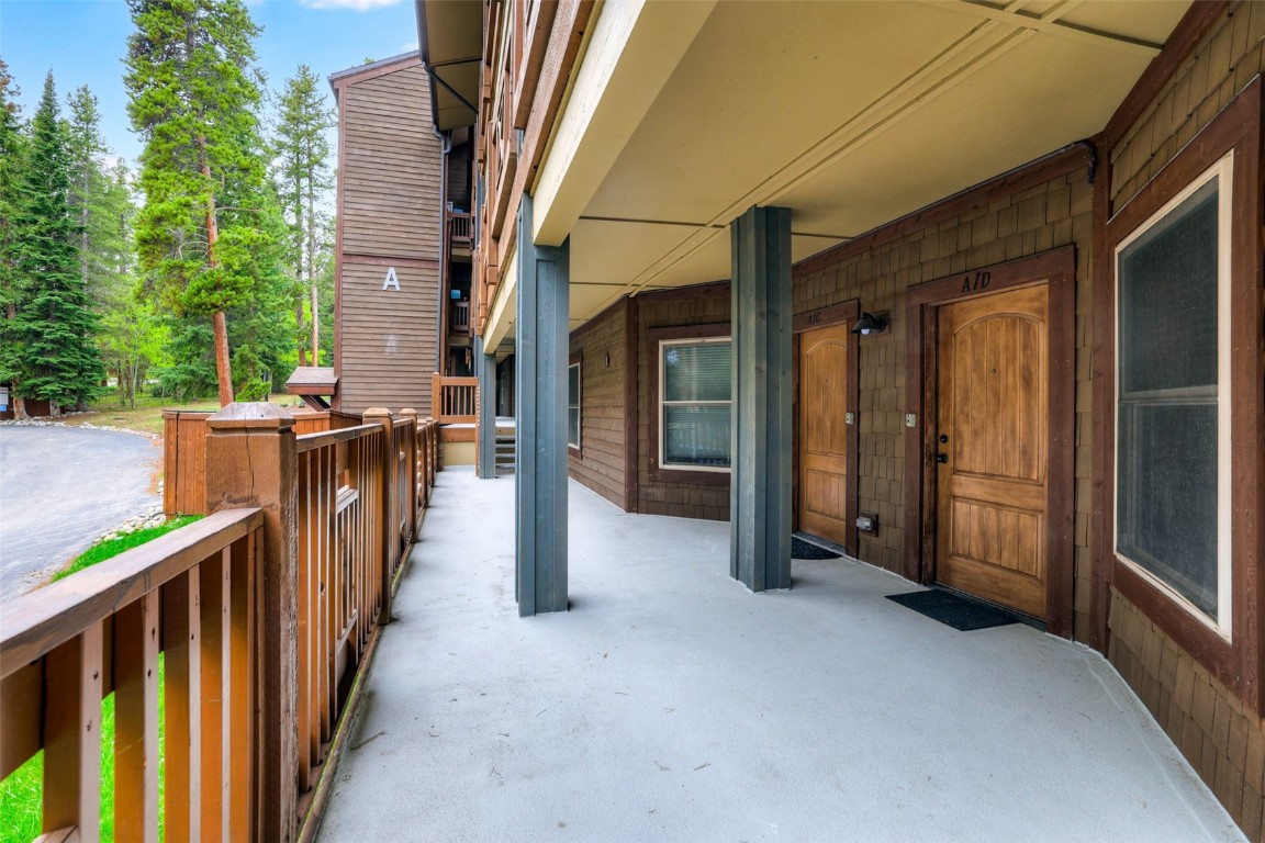 840 4 O Clock Road, Unit A1D Breckenridge, CO 80424 - Photo 24 of 38 a view of a porch with wooden floor and stairs