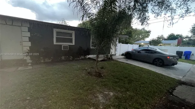 a car parked in front of a house