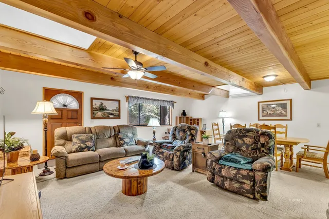 a kitchen with stainless steel appliances a stove a sink a refrigerator and cabinets