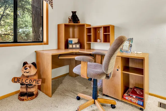 a view of a chairs and table on the wooden floor