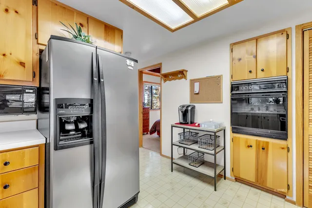 a bedroom with furniture and a flat screen tv
