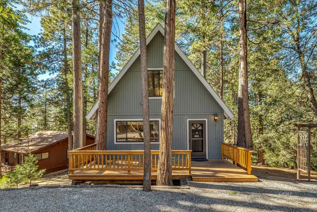 a view of balcony with wooden floor and fence