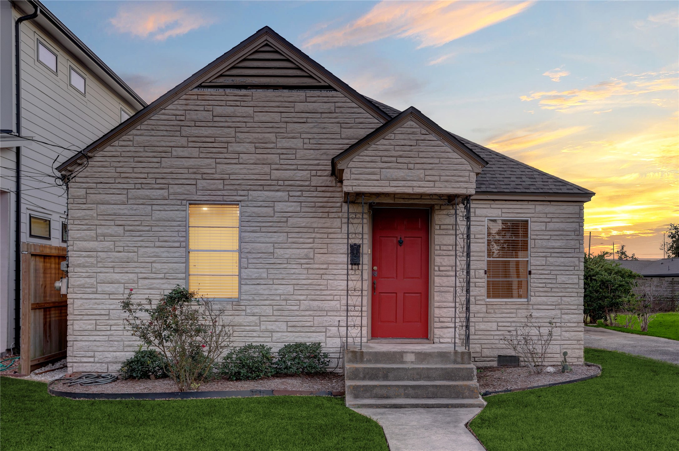 a front view of a house with garden