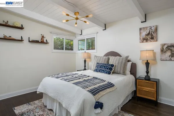 a bedroom with a bed and a couch
