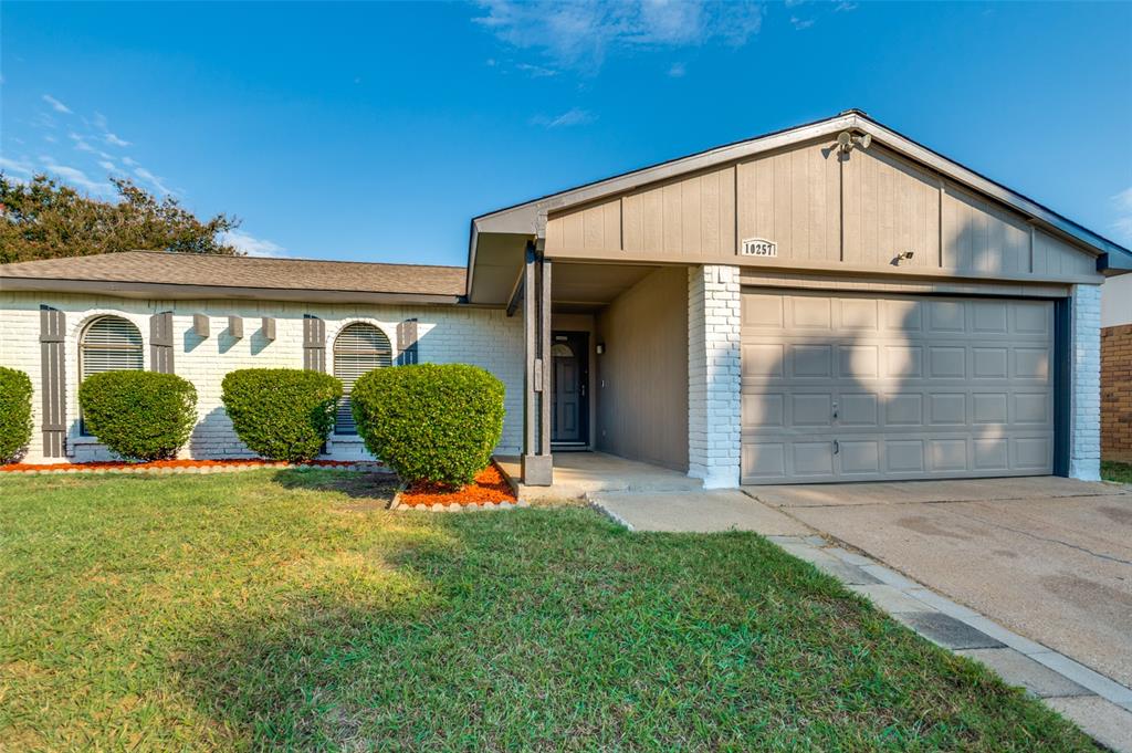 10257 Sweet Gum Street Dallas, TX 75249 - Photo 2 of 29 a front view of a house with garden