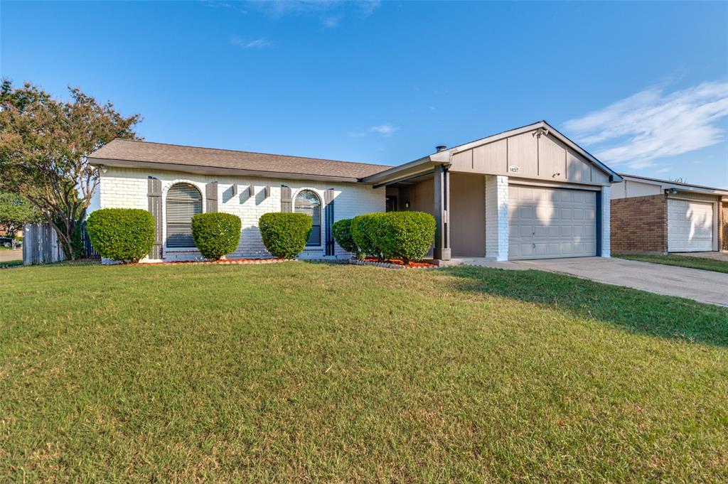 10257 Sweet Gum Street Dallas, TX 75249 - Photo 29 of 29 a front view of house with yard and green space