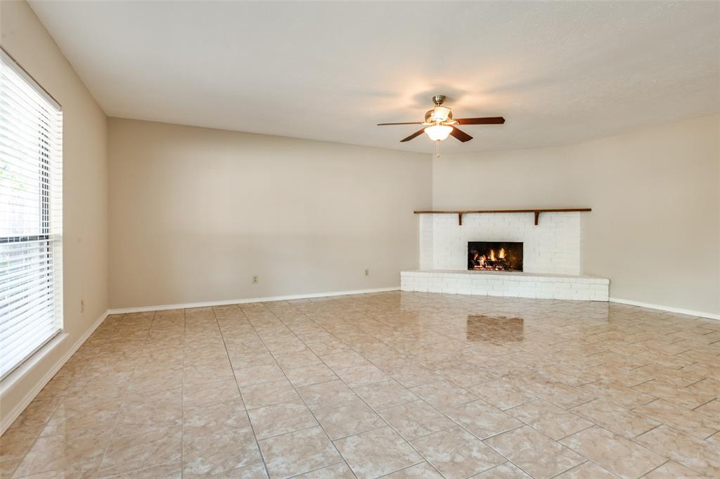 10257 Sweet Gum Street Dallas, TX 75249 - Photo 8 of 29 wooden floor in an empty room with a window