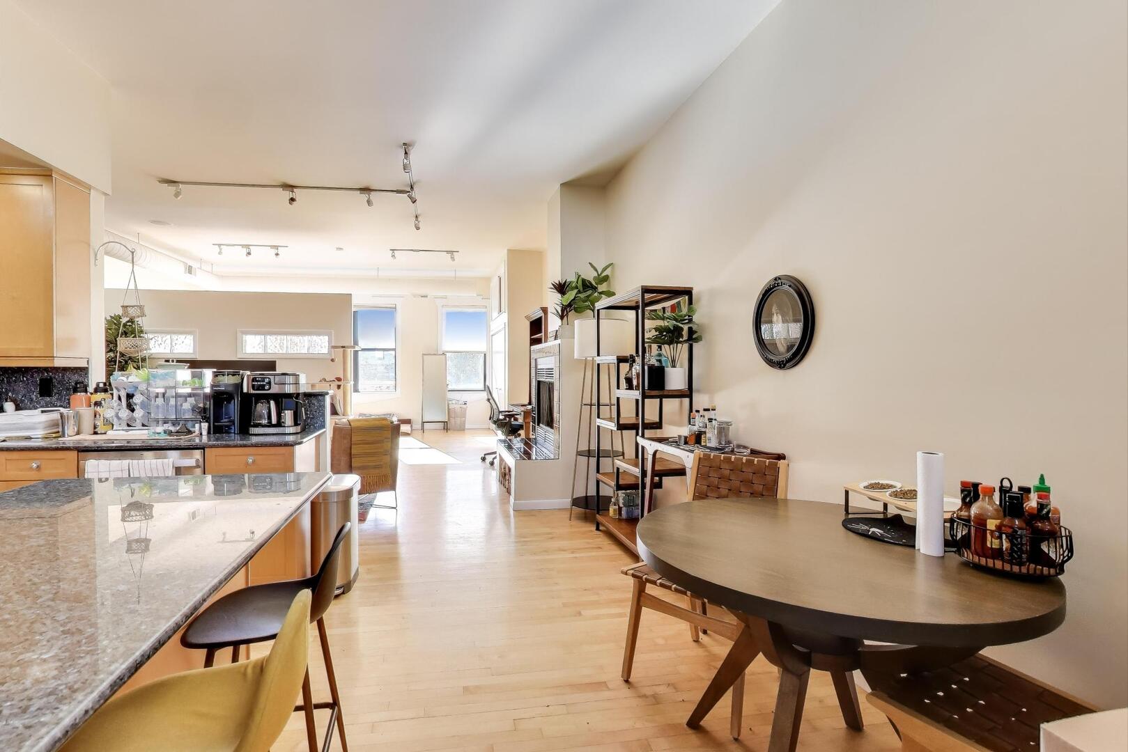 400 North Racine Avenue, Unit 204 Chicago, IL 60642 - Photo 10 of 22 a living room with lots of furniture and kitchen view
