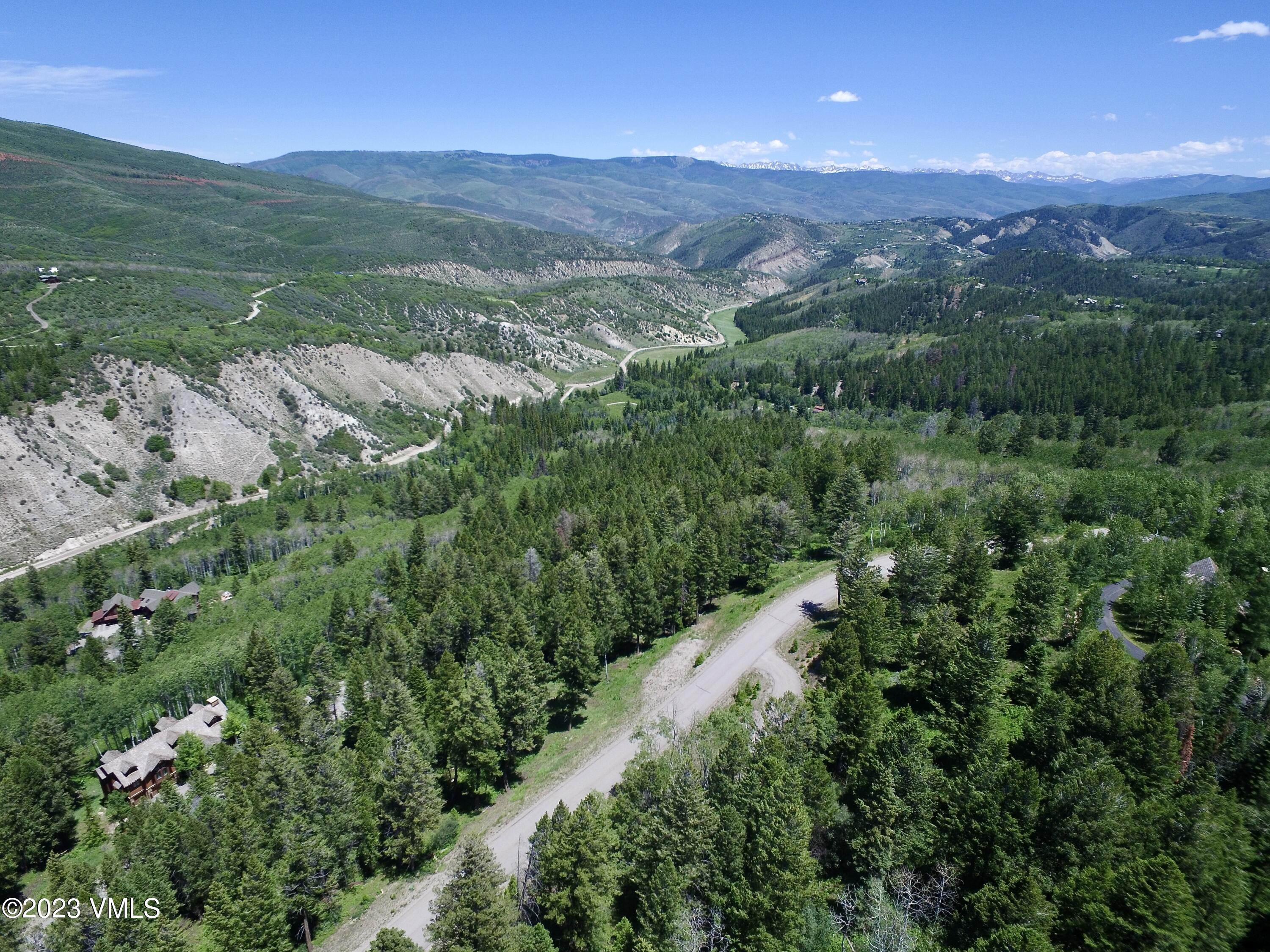 176 Sunquist Road Edwards, CO 81632 - Photo 19 of 19 a view of a lush green hillside and houses