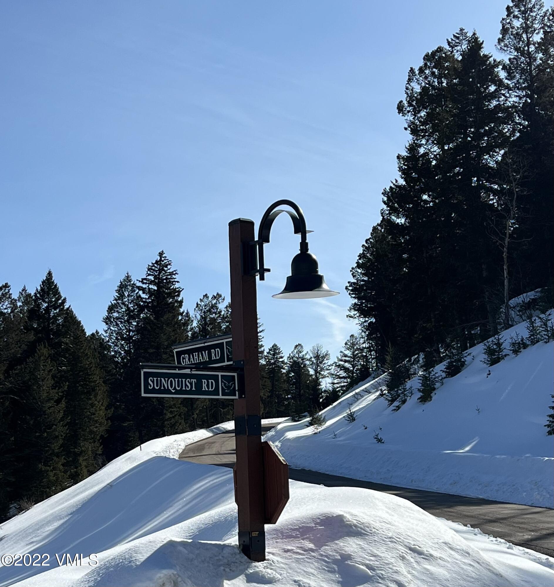 176 Sunquist Road Edwards, CO 81632 - Photo 9 of 19 a wooden bench sitting in front of a building