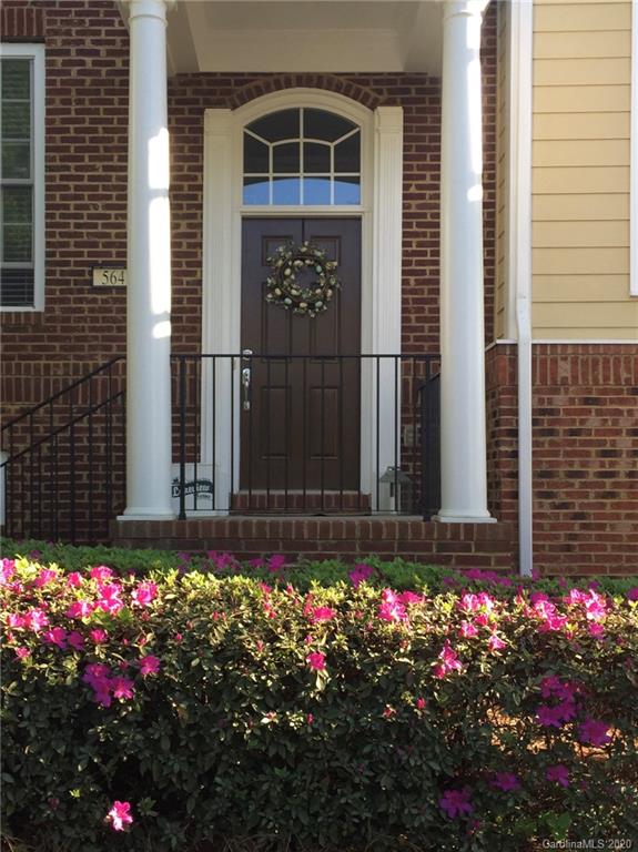 564 6th Baxter Crossing, Unit 13 Fort Mill, SC 29708 - Photo 2 of 39 a view of front door of house and flowers