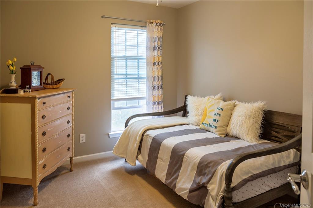 564 6th Baxter Crossing, Unit 13 Fort Mill, SC 29708 - Photo 12 of 39 a bed room with a bed and a window