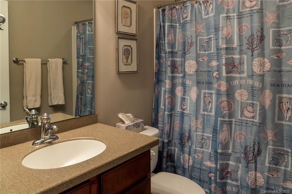 564 6th Baxter Crossing, Unit 13 Fort Mill, SC 29708 - Photo 14 of 39 a bathroom with a sink toilet and a mirror