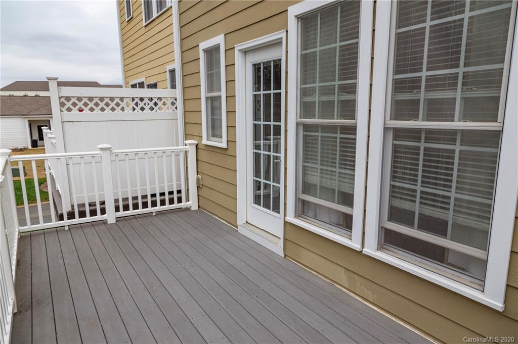 564 6th Baxter Crossing, Unit 13 Fort Mill, SC 29708 - Photo 20 of 39 a view of a balcony with wooden floor