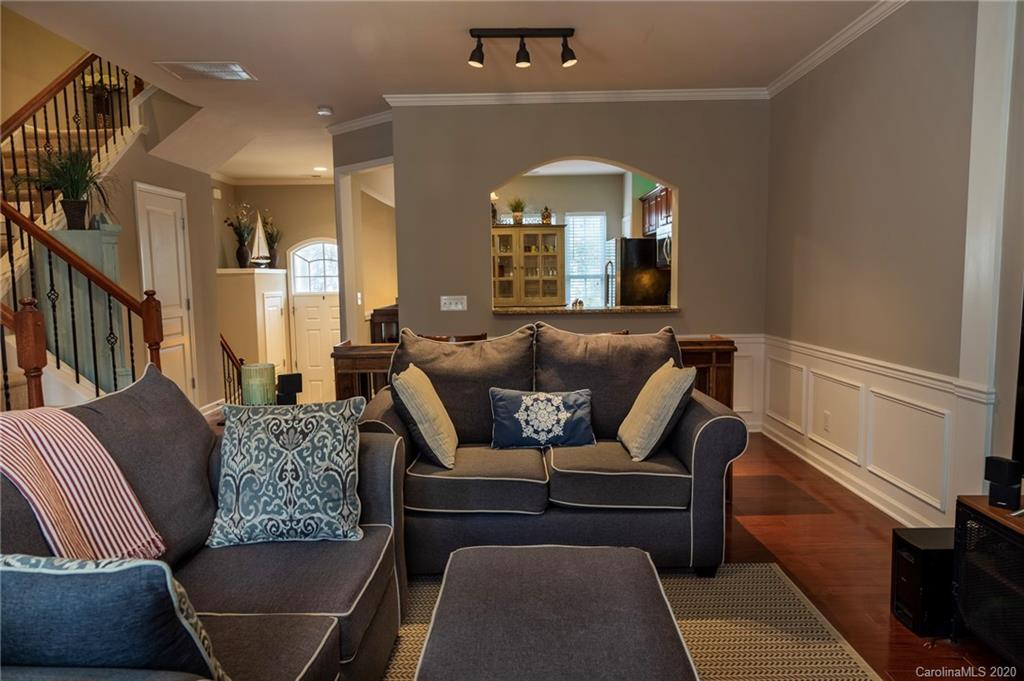 564 6th Baxter Crossing, Unit 13 Fort Mill, SC 29708 - Photo 3 of 39 a living room with furniture and a fireplace