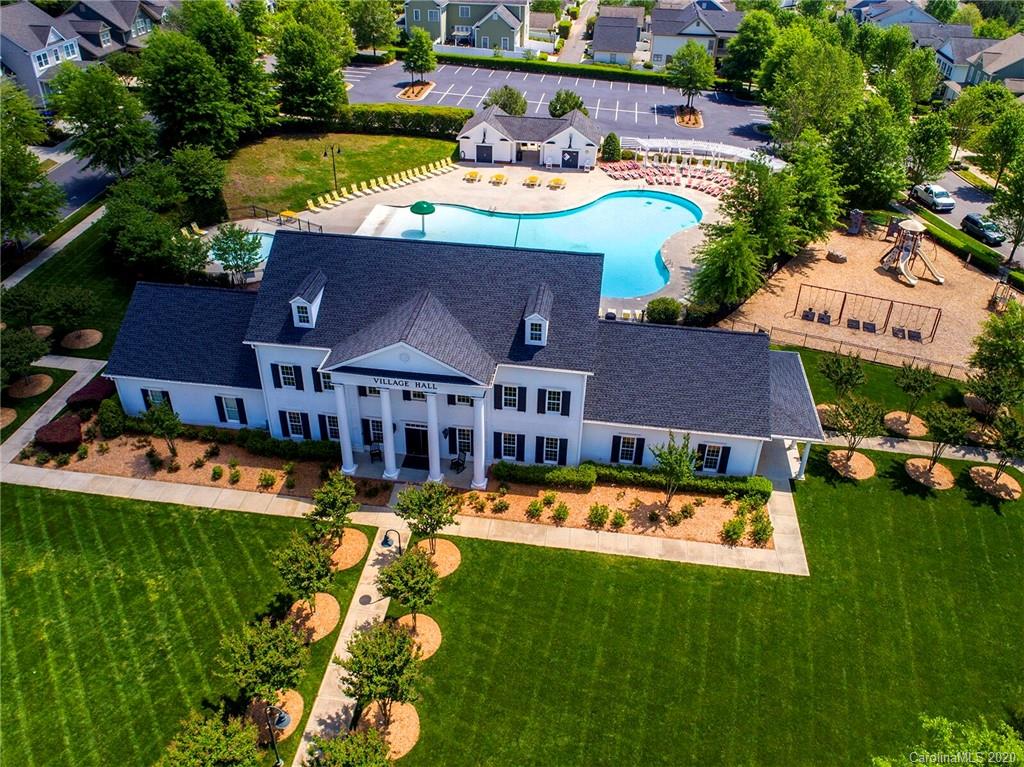 564 6th Baxter Crossing, Unit 13 Fort Mill, SC 29708 - Photo 23 of 39 a view of a house with swimming pool and yard