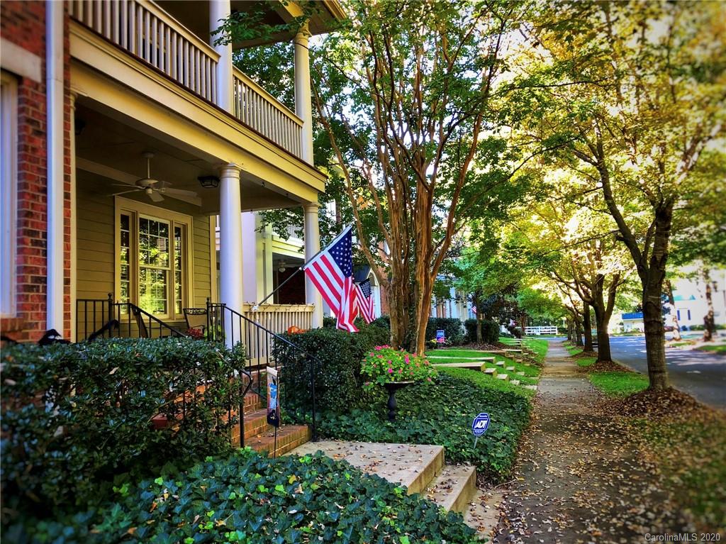 564 6th Baxter Crossing, Unit 13 Fort Mill, SC 29708 - Photo 28 of 39 a front view of a house with a yard and tree s