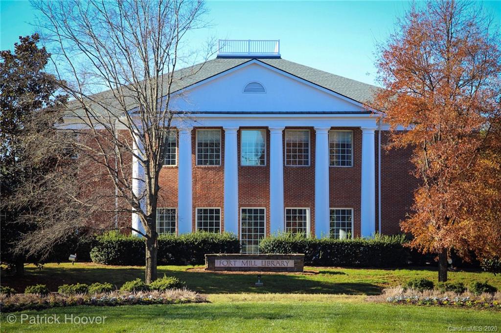 564 6th Baxter Crossing, Unit 13 Fort Mill, SC 29708 - Photo 29 of 39 a front view of a building with yard and trees