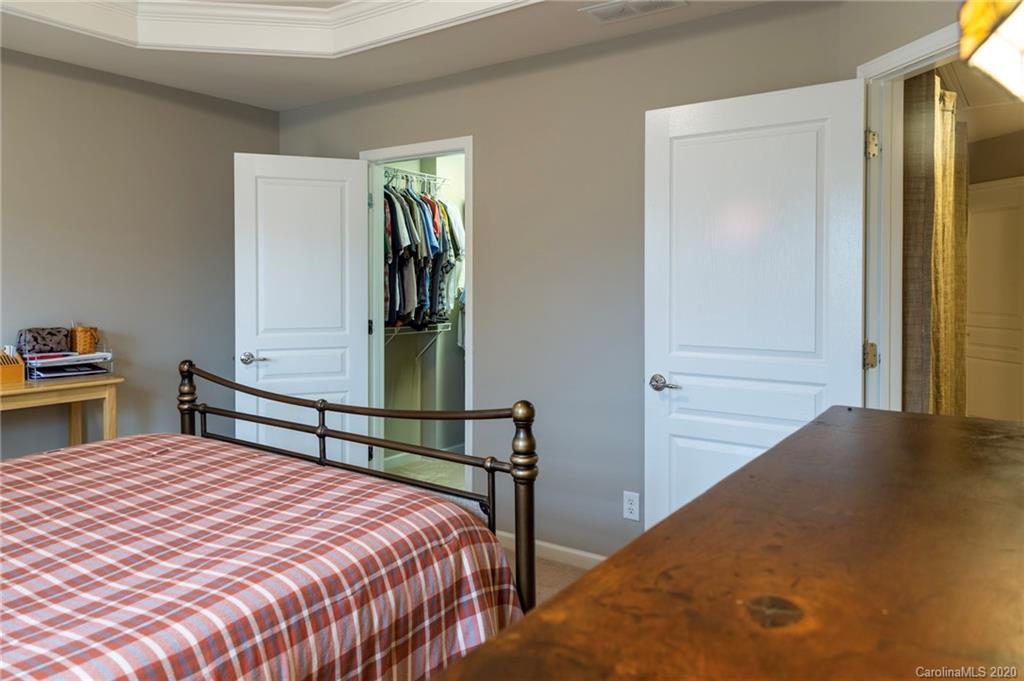 564 6th Baxter Crossing, Unit 13 Fort Mill, SC 29708 - Photo 9 of 39 a bedroom with a bed and a closet