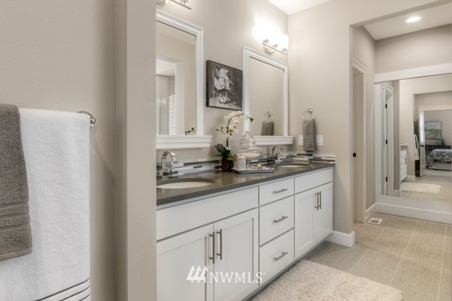 1428 241st (11) Place Southeast Bothell, WA 98021 - Photo 15 of 21 a bathroom with a double vanity sink and a mirror