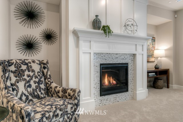 1428 241st (11) Place Southeast Bothell, WA 98021 - Photo 7 of 21 a living room with a fireplace with a fireplace