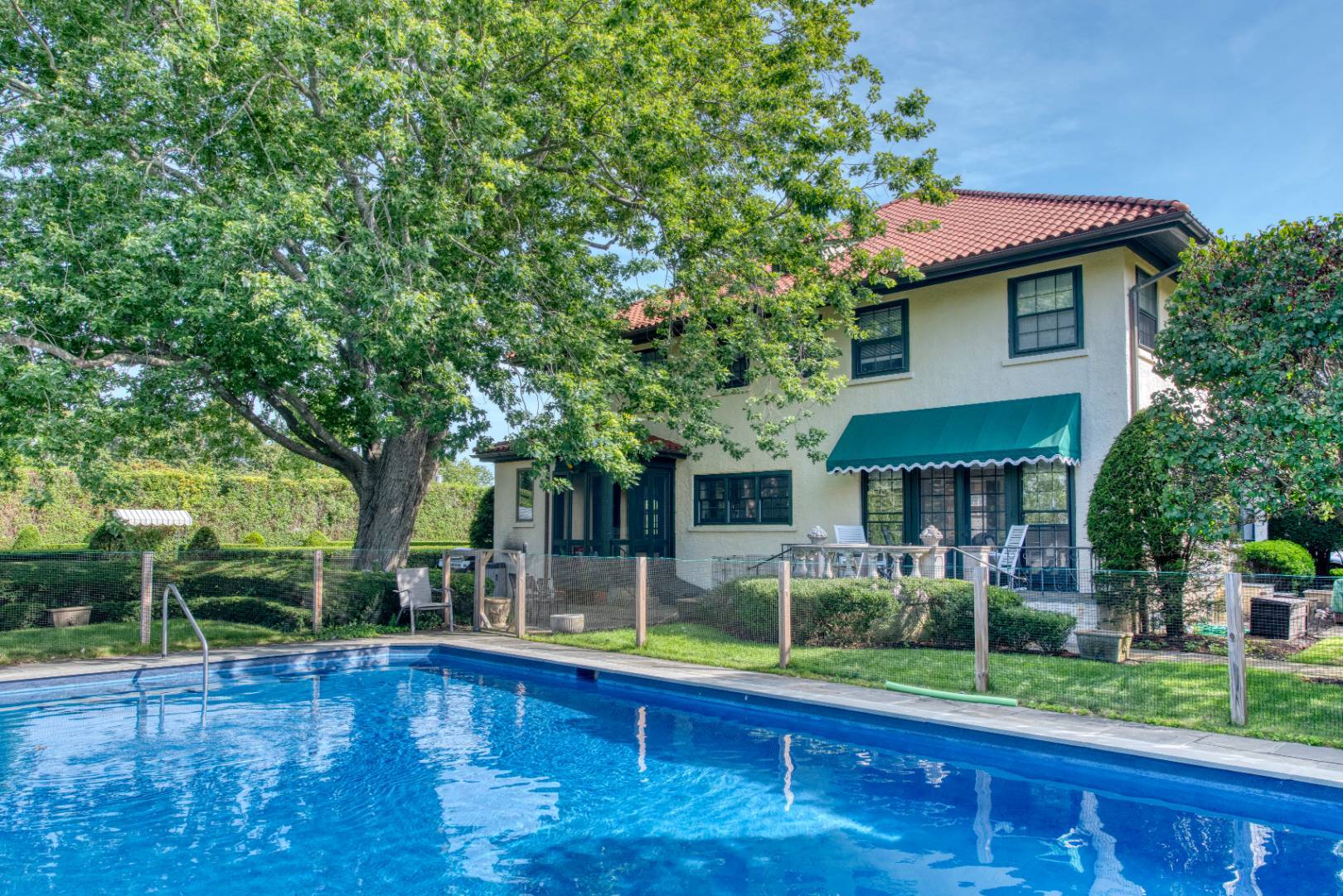 a front view of house with yard and outdoor seating
