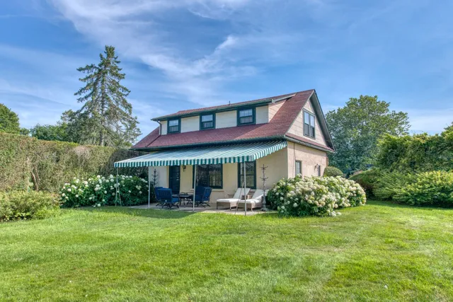 a view of a house with table and chairs