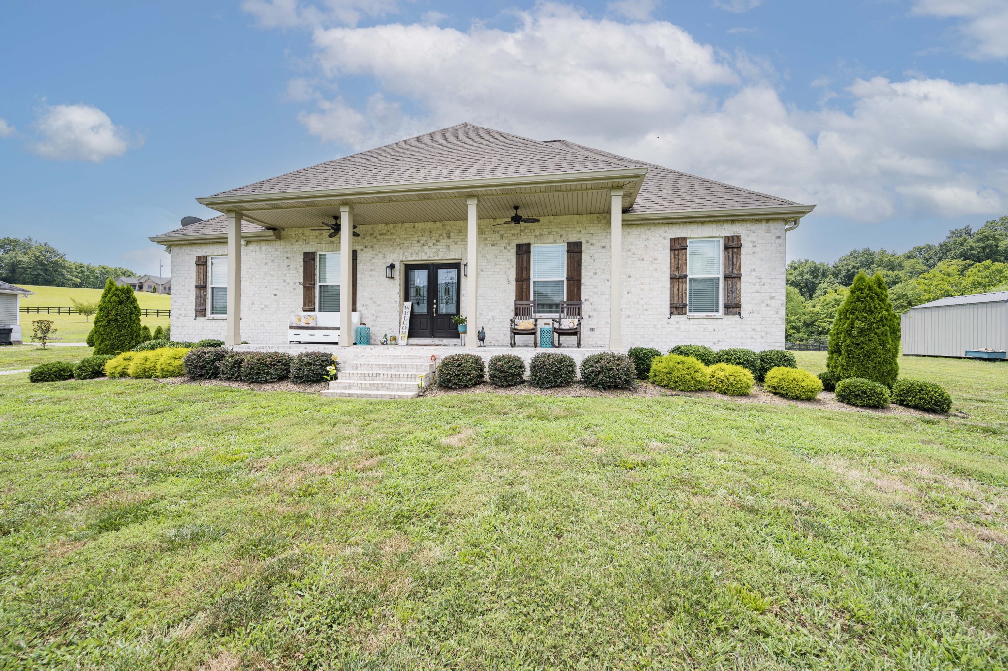 1632 Old Gallatin Road Portland, TN 37148 - Photo 1 of 37 a front view of a house with a yard