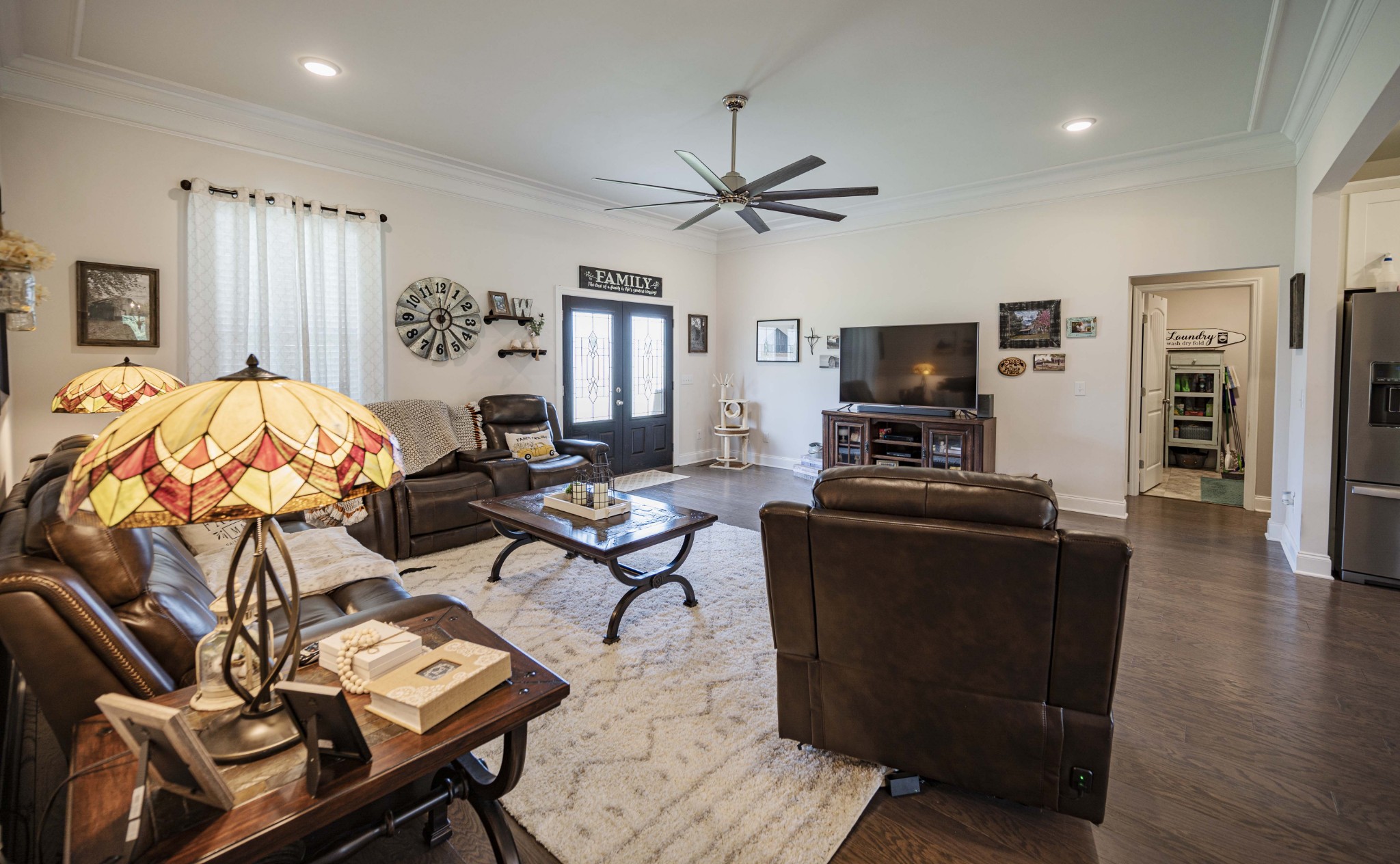 1632 Old Gallatin Road Portland, TN 37148 - Photo 11 of 37 a living room with furniture a flat screen tv and kitchen view