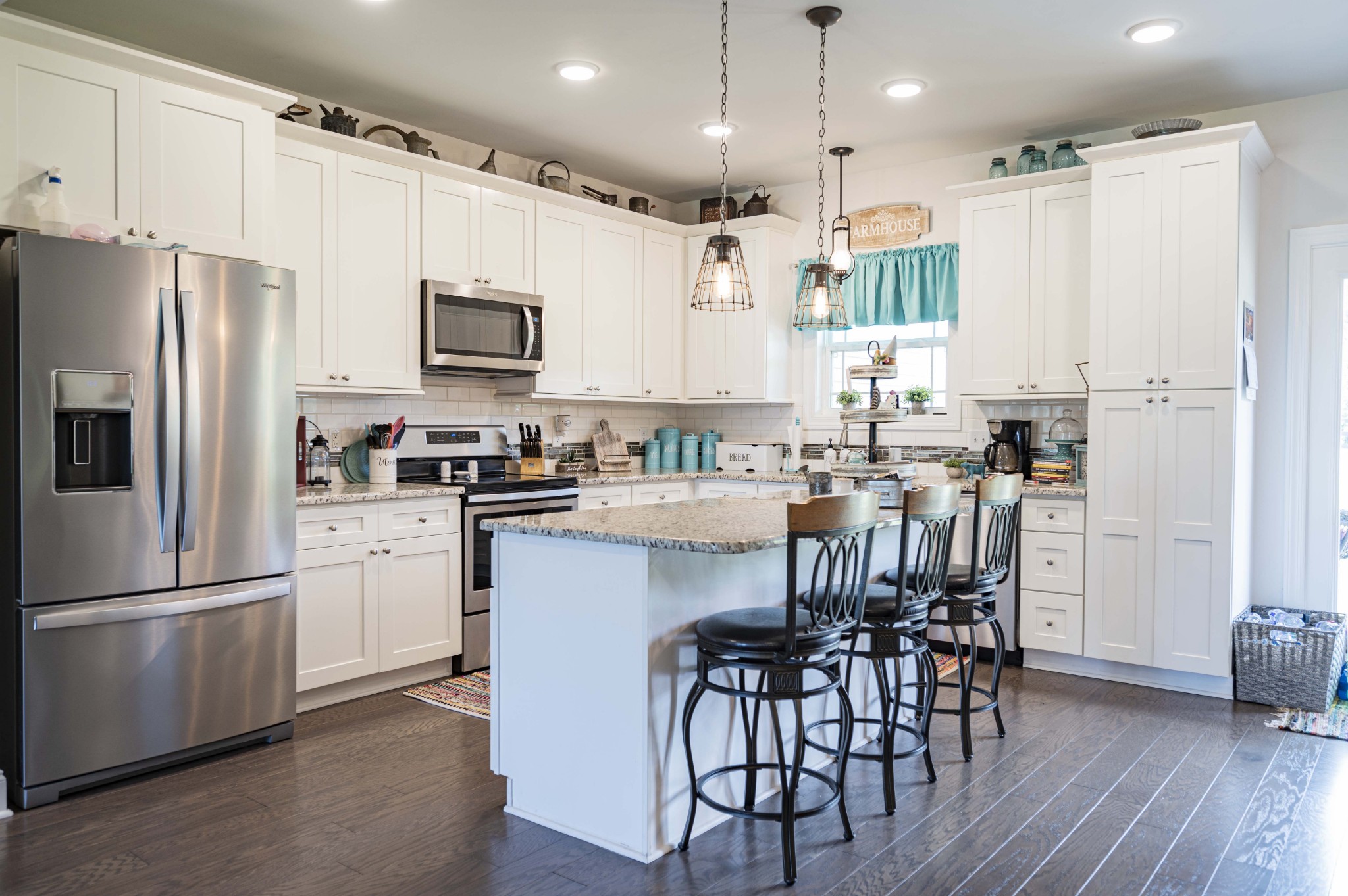 1632 Old Gallatin Road Portland, TN 37148 - Photo 15 of 37 a kitchen with kitchen island granite countertop a refrigerator a sink and white appliances