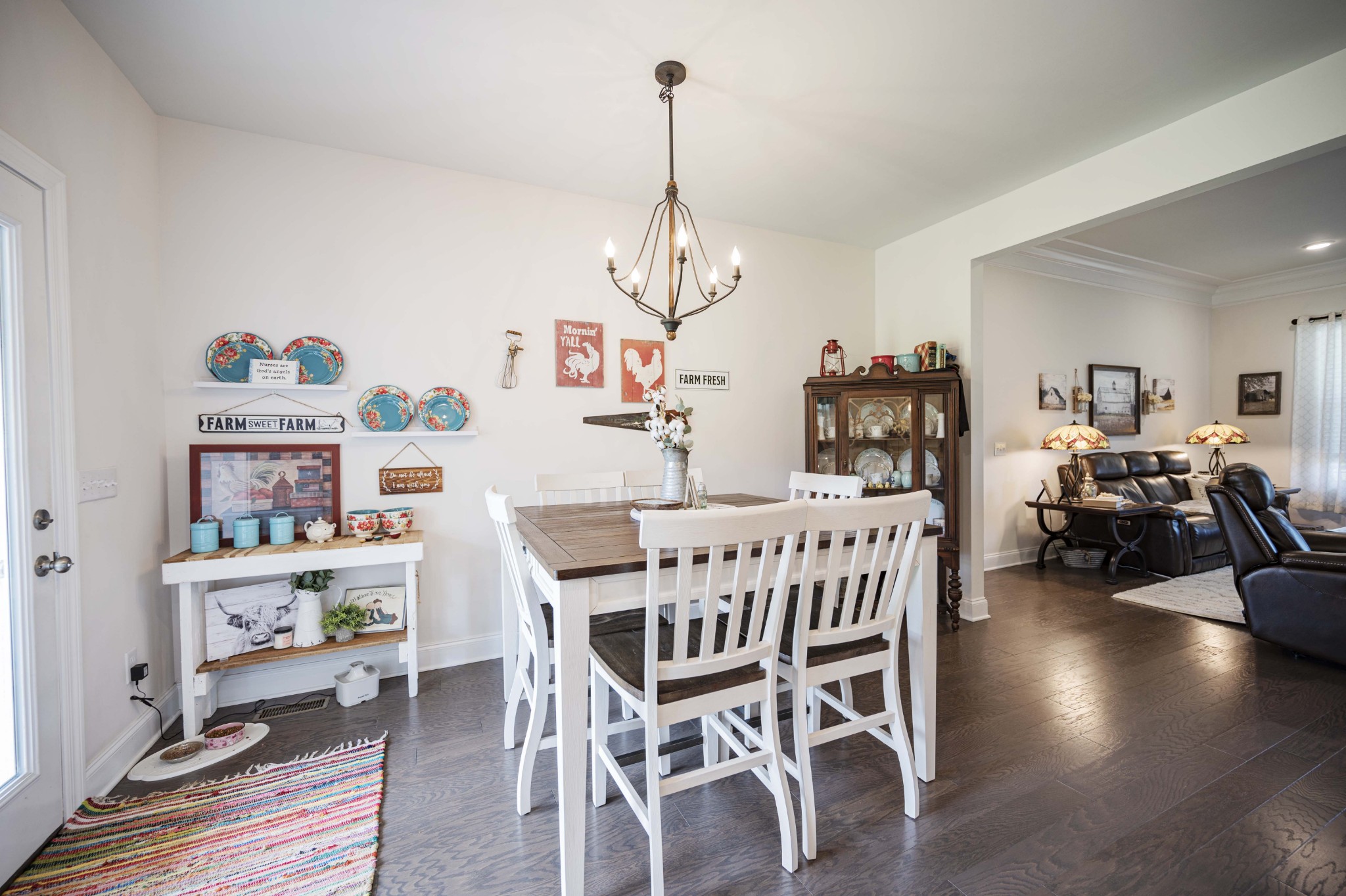 1632 Old Gallatin Road Portland, TN 37148 - Photo 17 of 37 a view of a dining room with furniture wooden floor and a chandelier