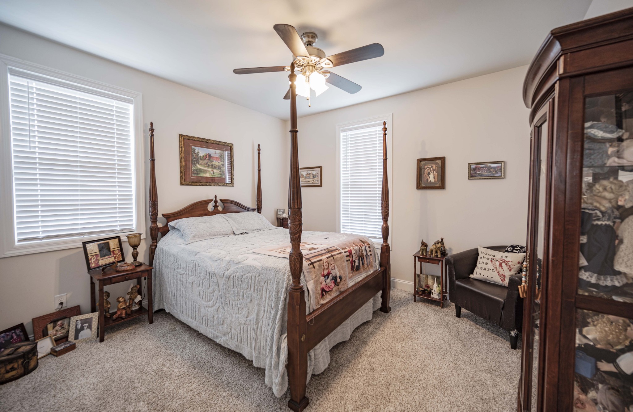 1632 Old Gallatin Road Portland, TN 37148 - Photo 28 of 37 a bedroom with a bed and a chandelier