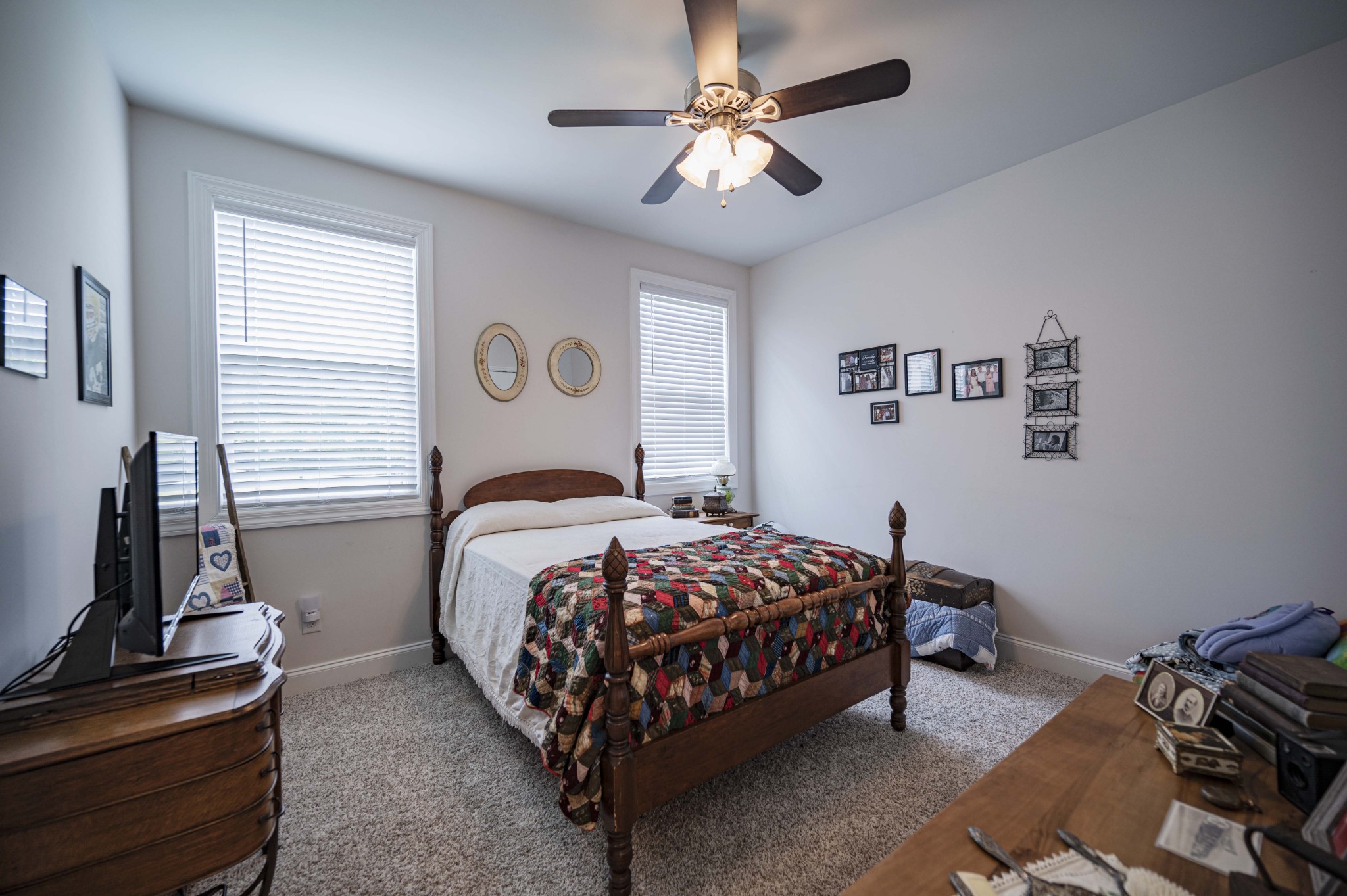 1632 Old Gallatin Road Portland, TN 37148 - Photo 32 of 37 a bedroom with a bed and a chandelier