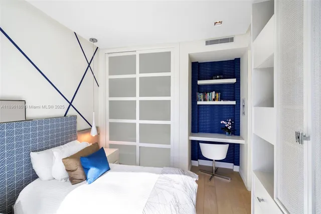 a bedroom with a bed and a closet