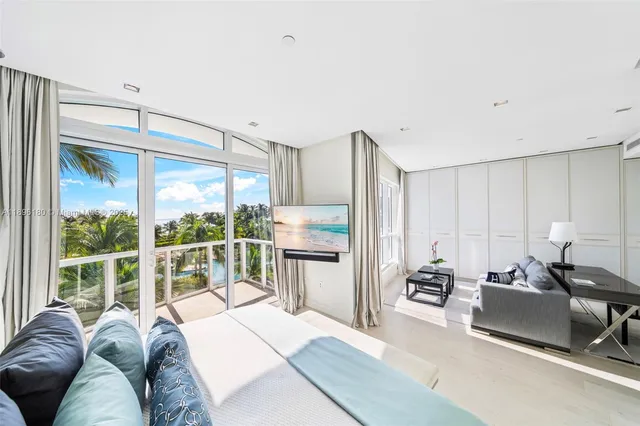 a bed room with a bed and a large window