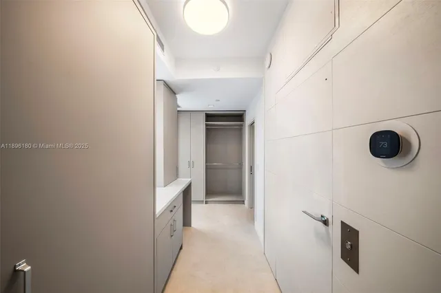 a bathroom with a granite countertop sink toilet and a mirror
