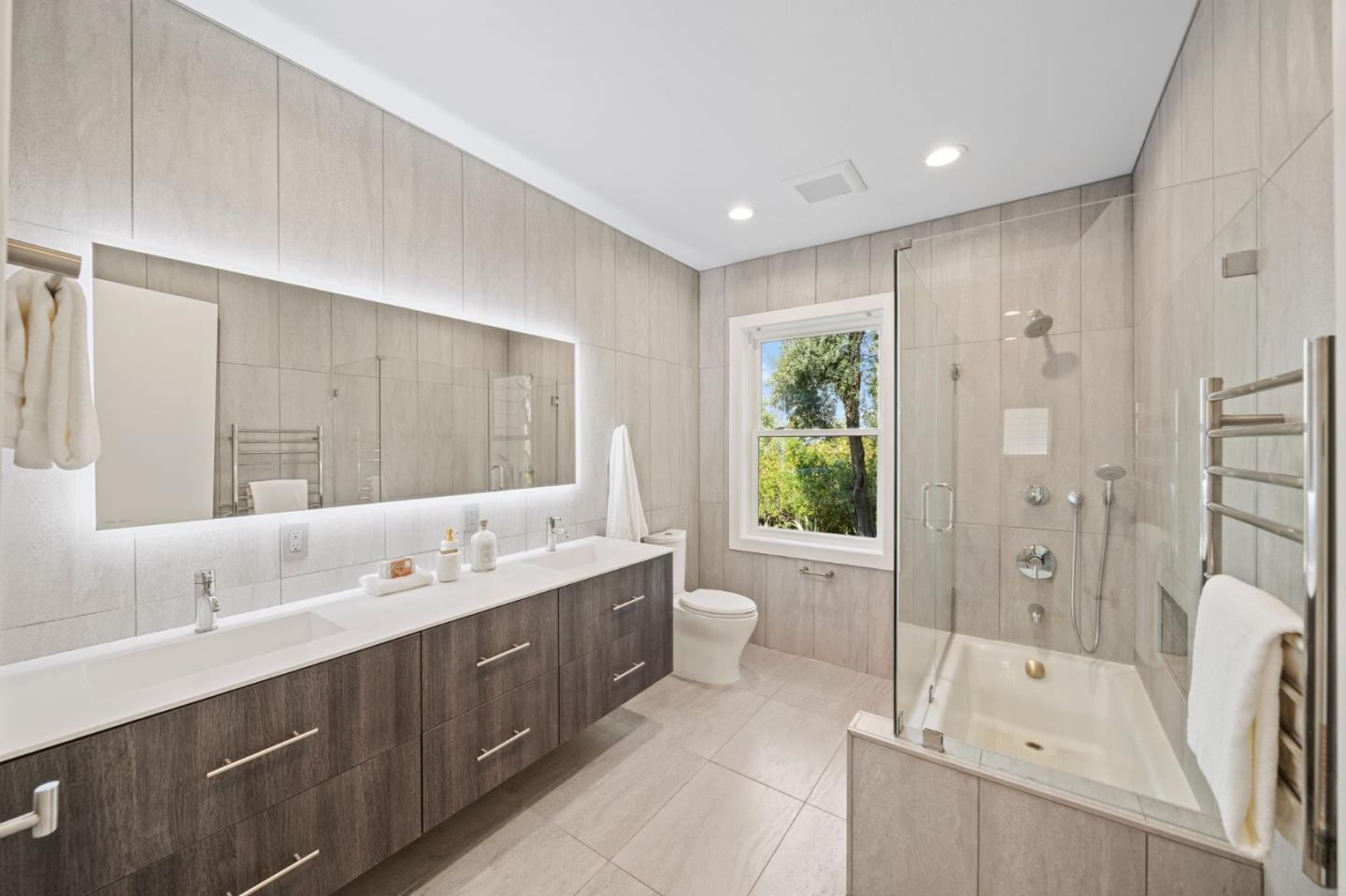 2698 Greenrock Road Milpitas, CA 95035 - Photo 50 of 99 a spacious bathroom with a double vanity sink large mirror and a bathtub