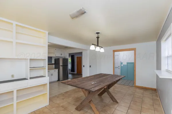 a living room with stainless steel appliances kitchen island granite countertop furniture and a kitchen view