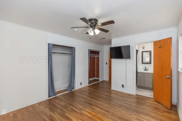 a view of a livingroom with a chandelier fan