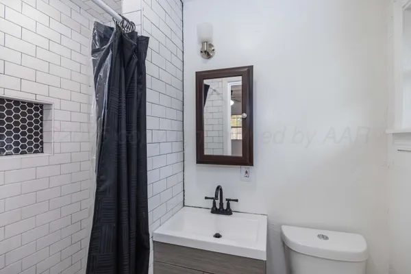a bathroom with a sink and a toilet
