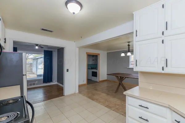a view of kitchen with furniture and window