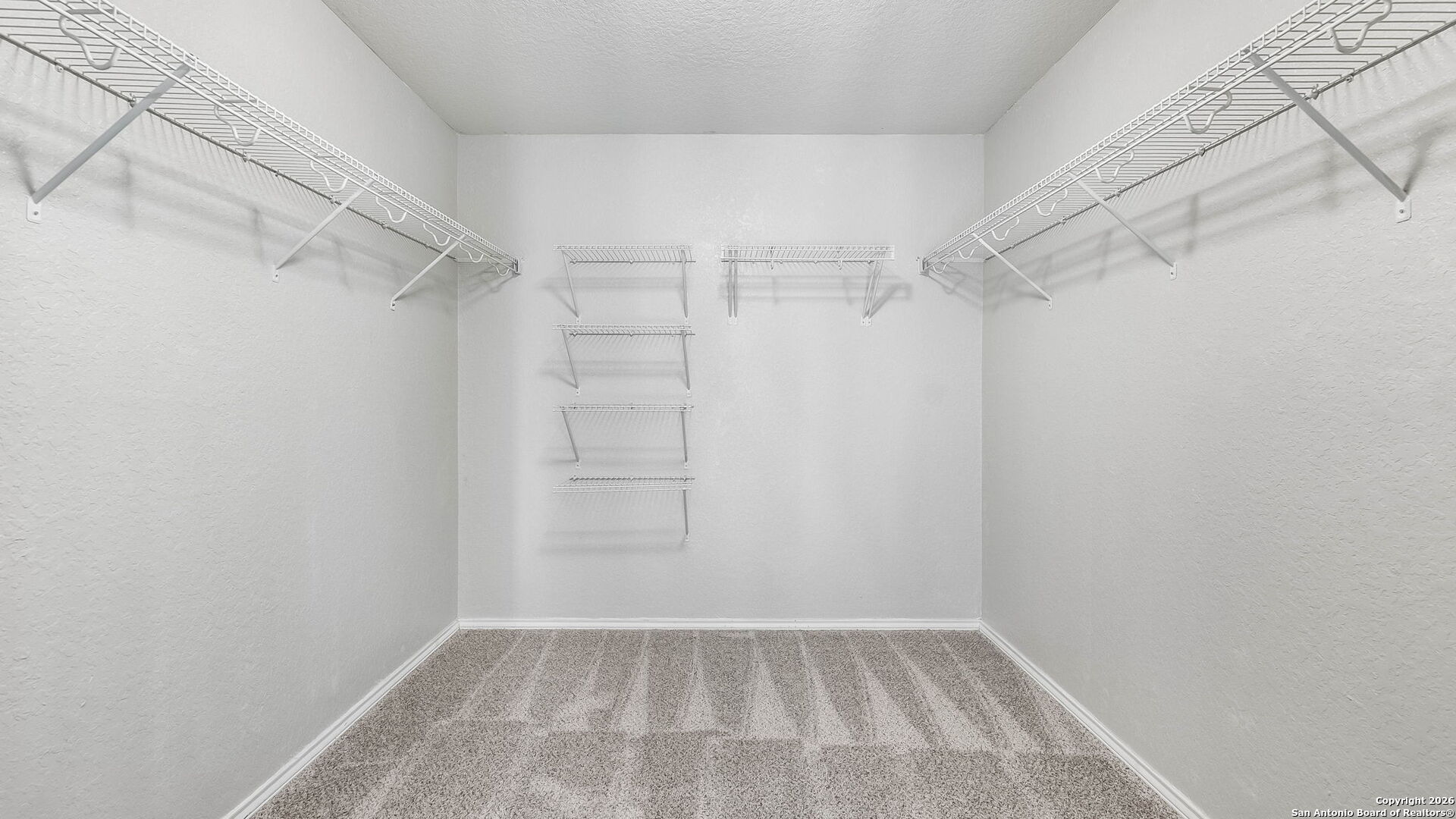 7690 Paraiso Boerne, TX 78015 - Photo 14 of 21 a view of a room with racks on the wall