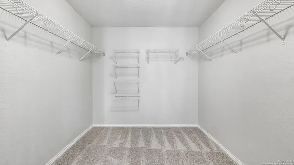 a view of a room with racks on the wall