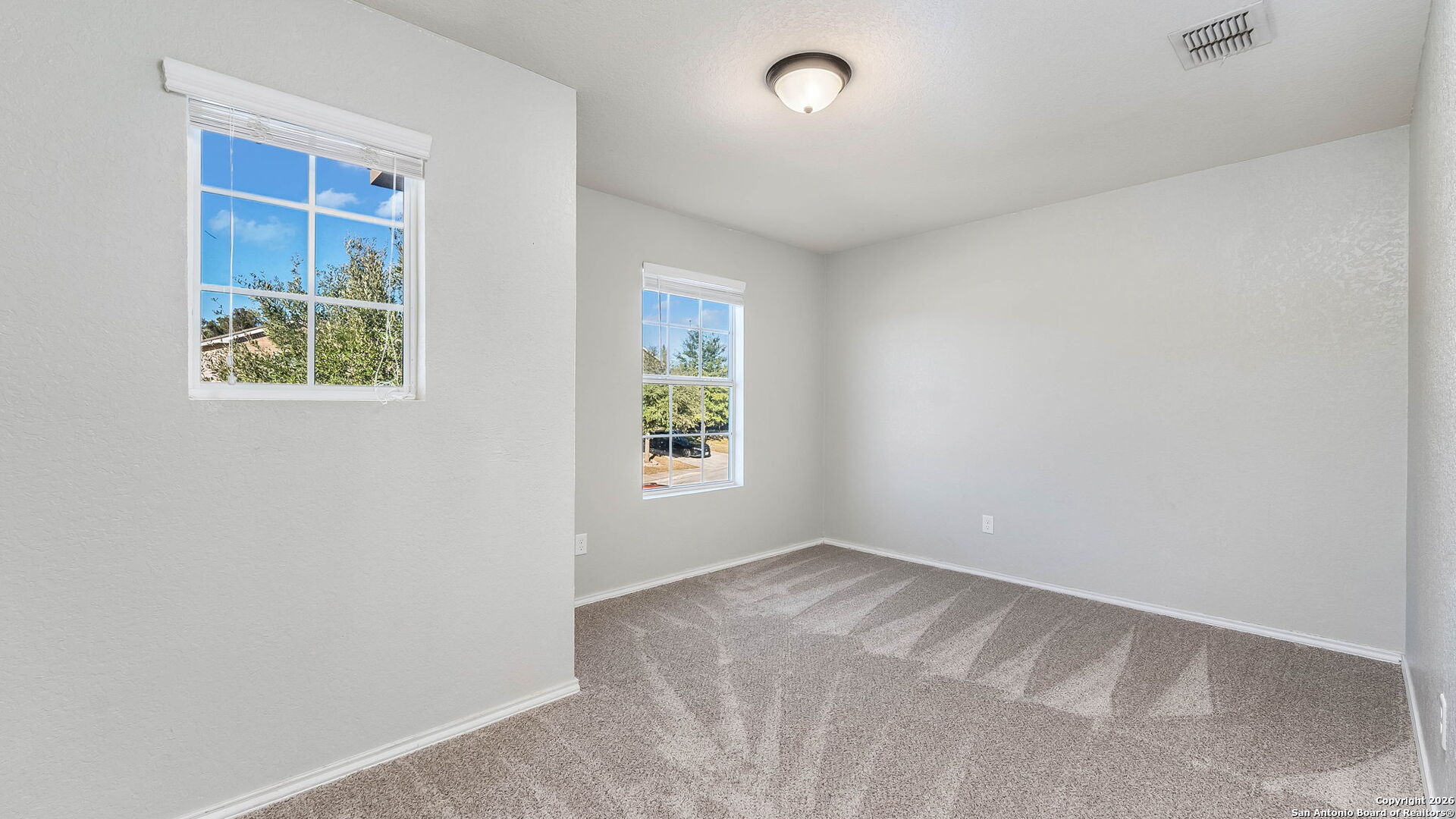 7690 Paraiso Boerne, TX 78015 - Photo 19 of 24 an empty room with windows