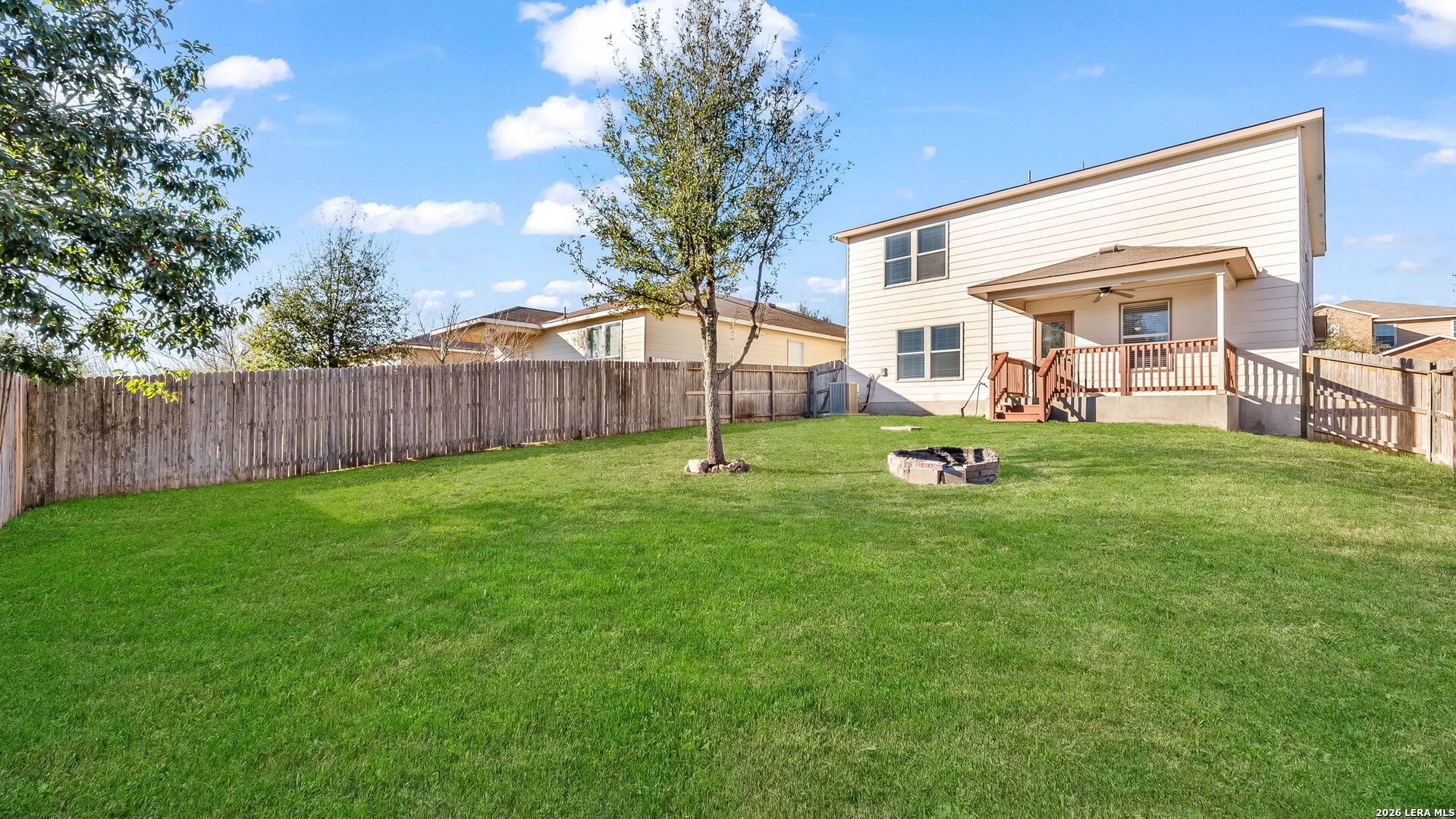 7690 Paraiso Boerne, TX 78015 - Photo 2 of 24 a view of a backyard with a garden and trees