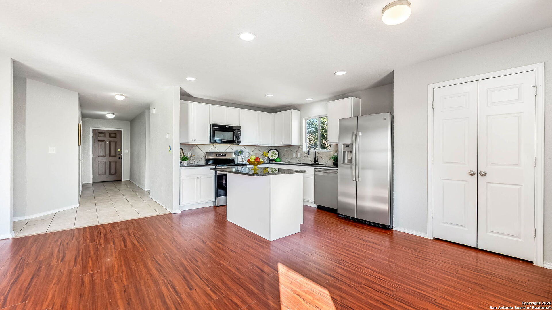 7690 Paraiso Boerne, TX 78015 - Photo 6 of 24 a kitchen with a refrigerator and a sink