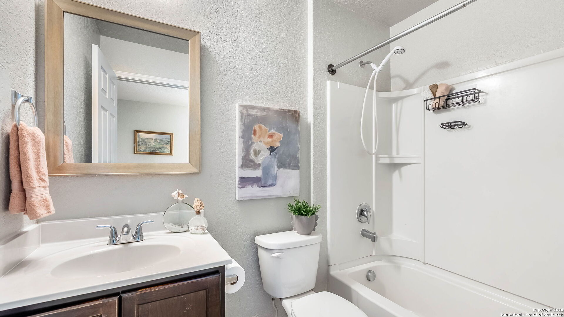 7690 Paraiso Boerne, TX 78015 - Photo 9 of 21 a bathroom with a sink toilet and shower