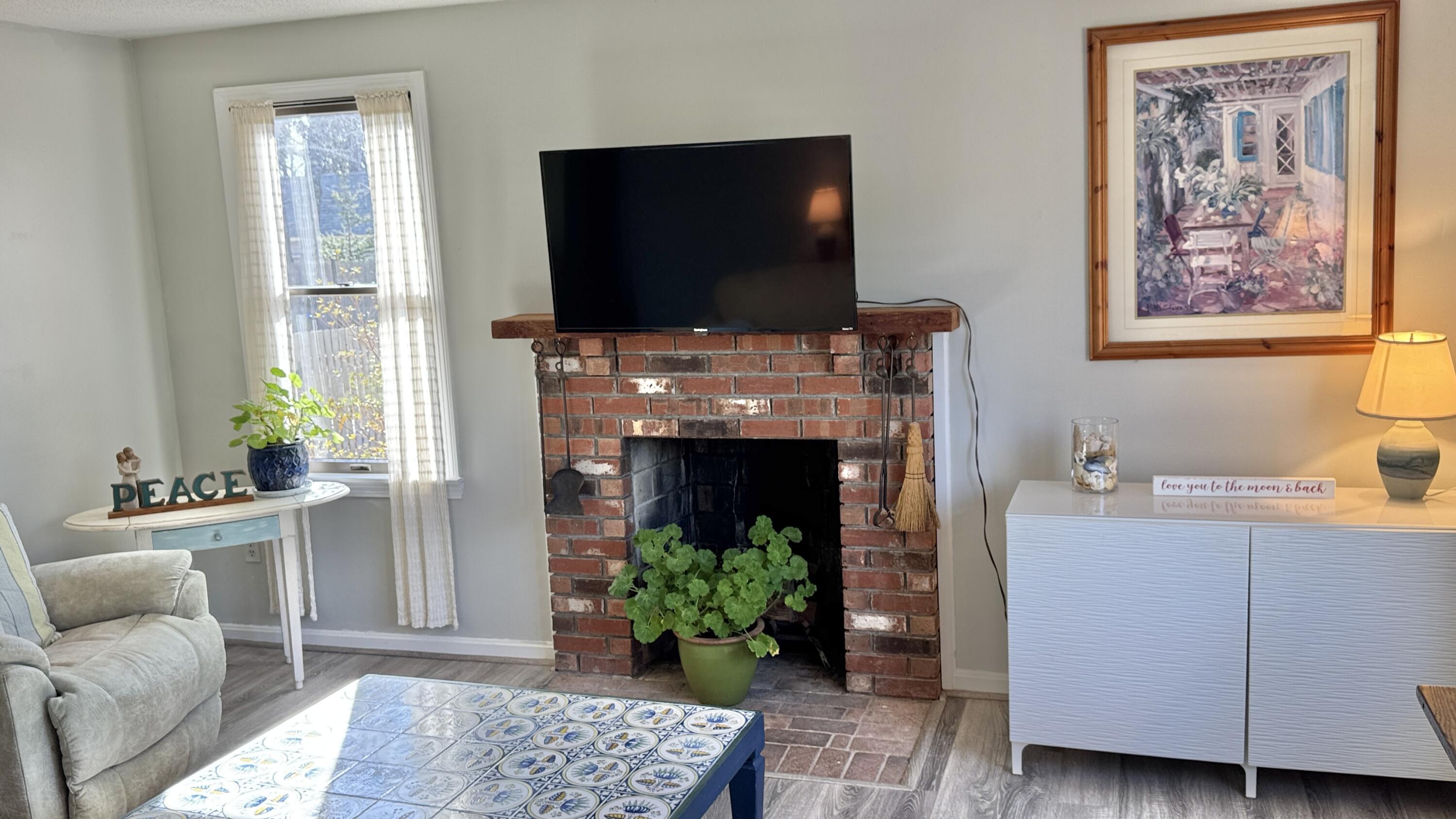 300 Brackett Road Eastham, MA 02642 - Photo 17 of 30 a living room with furniture and a flat screen tv