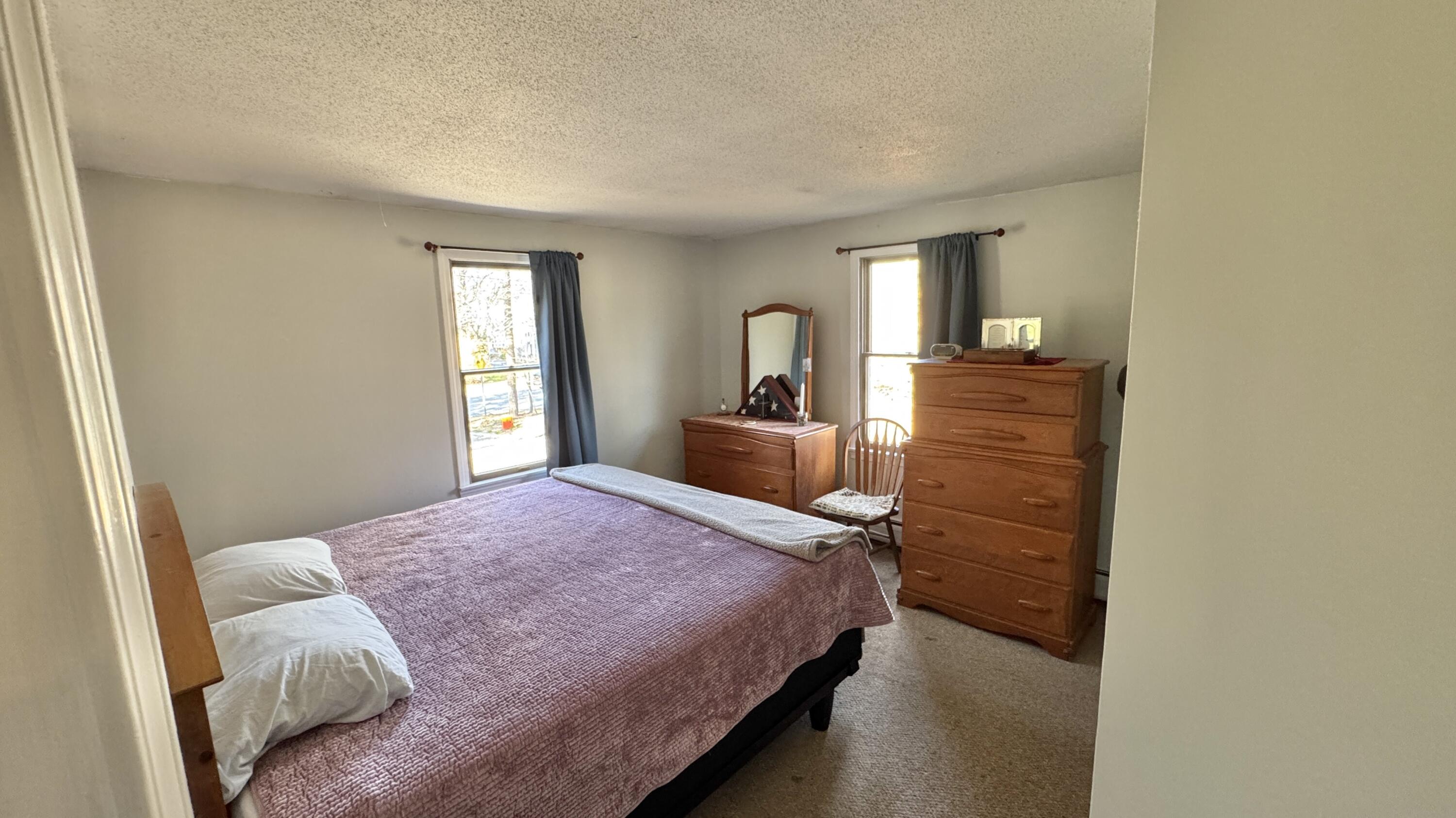 300 Brackett Road Eastham, MA 02642 - Photo 23 of 30 a bedroom with a bed and a large window